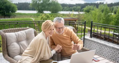 Adult daughter and senior father spending time together at their Atherton home, highlighting compassionate in-home senior care services.