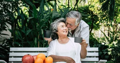 Elderly couple in Dublin bonding and drinking coffee