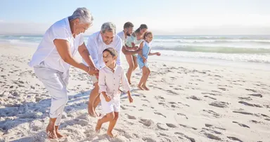 Big family in el Granada bonding and playing along the coastal shores